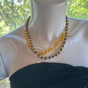 Orange beaded necklace and shell necklace from the 70s